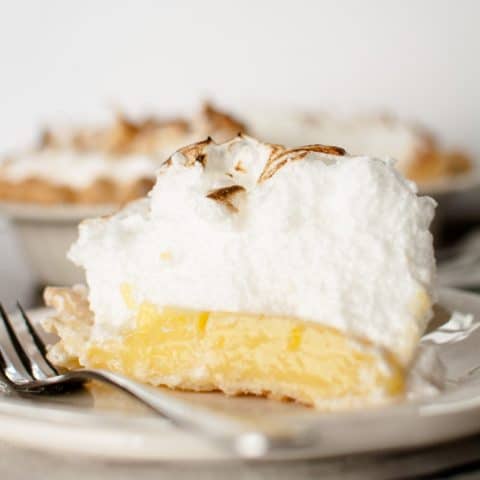 Slice of lemon meringue pie on a plate