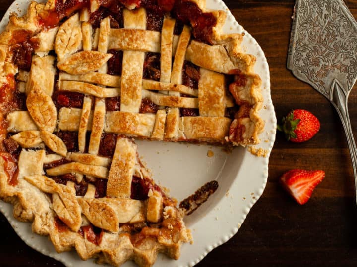 Gluten Free Strawberry Rhubarb Pie with one slice removed