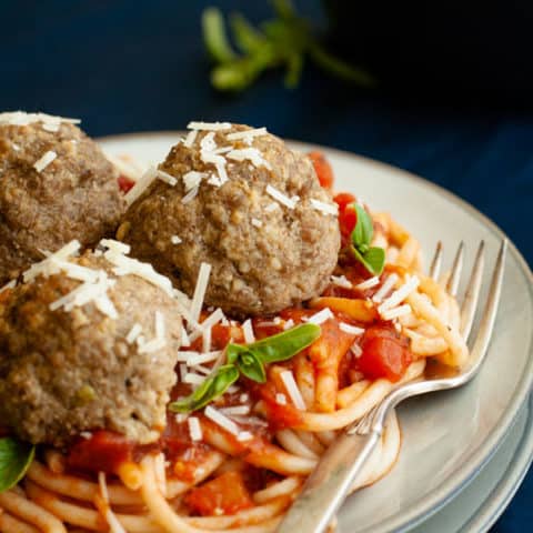 GLuten Free Spaghetti and Meatballs with parmesan and basil topping