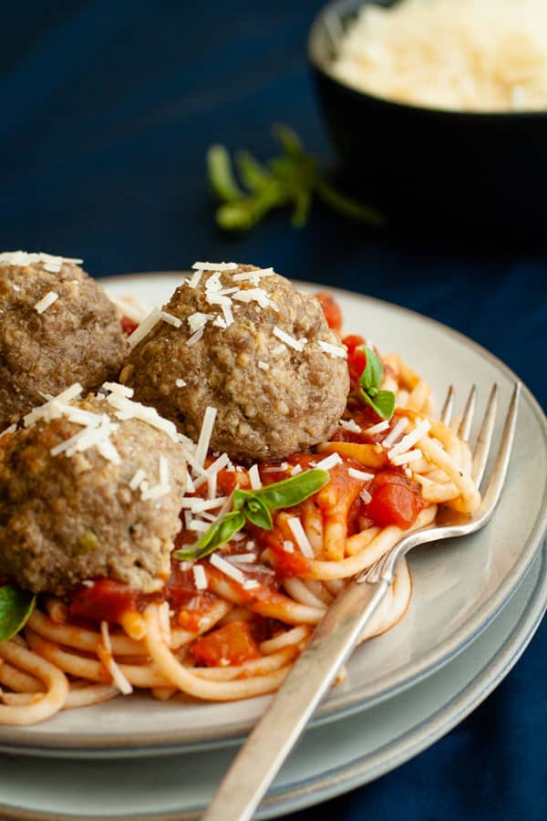 GLuten Free Spaghetti and Meatballs with parmesan and basil topping