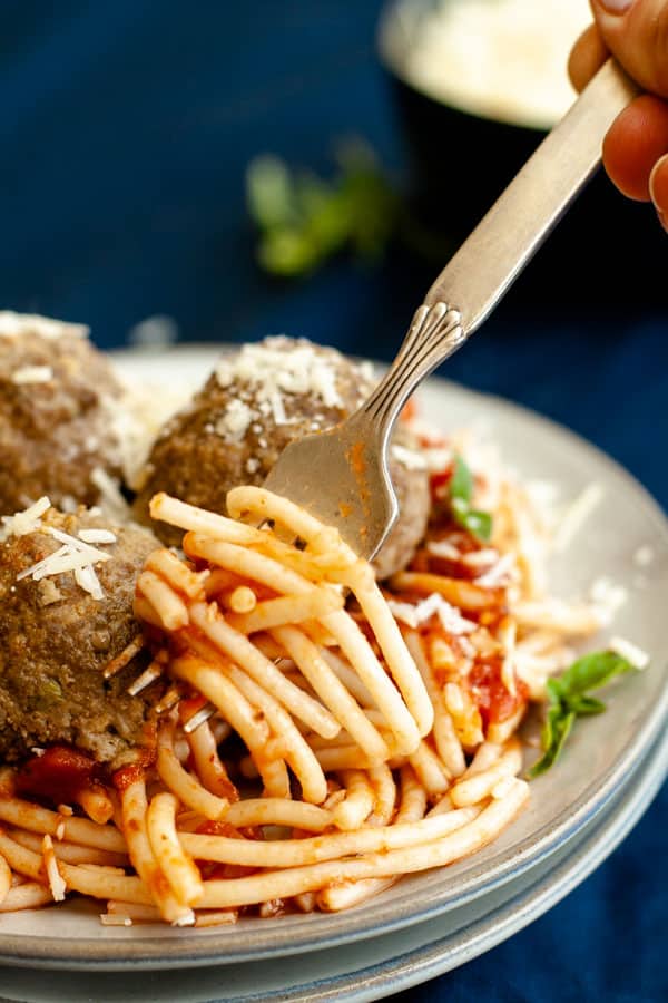 Gluten Free Spaghetti and Meatballs with noodles spinning around fork