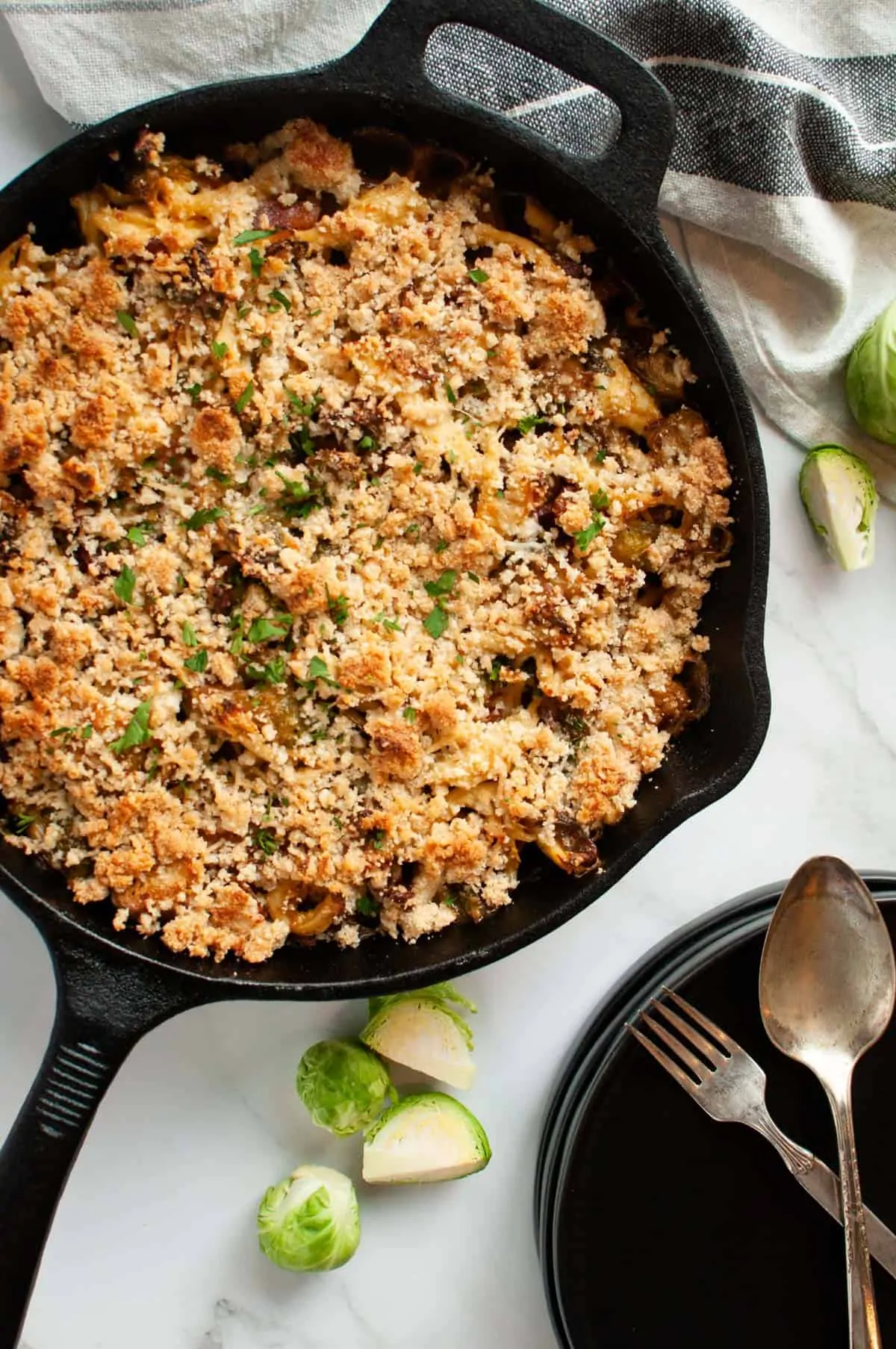 Chicken and brussel sprouts casserole in a cast iron skillet ready to be served