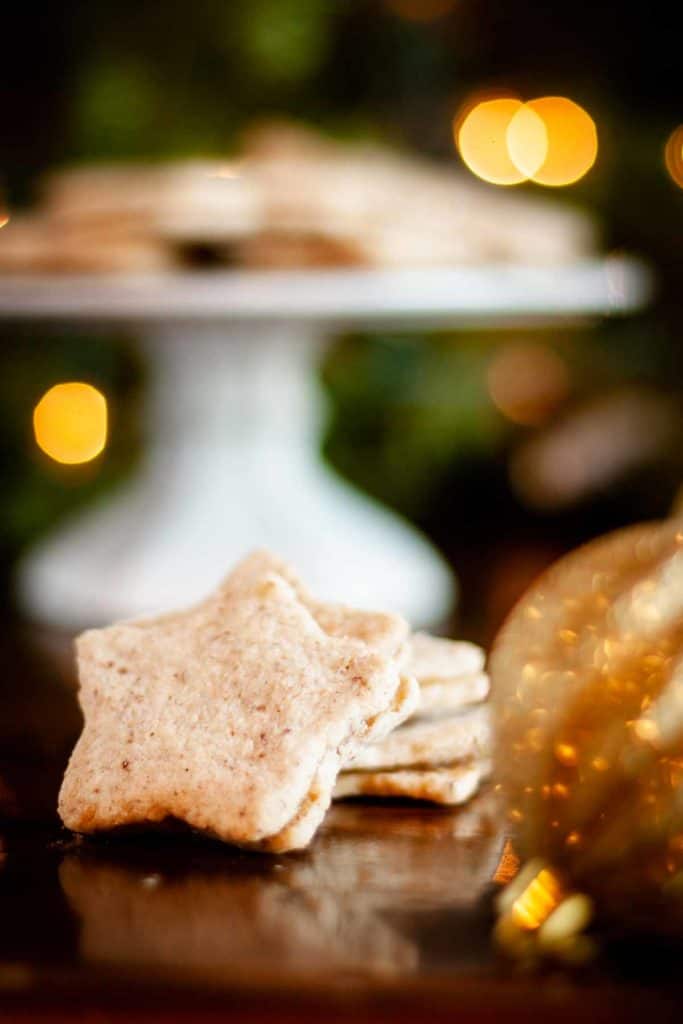 Close up of star cutout and filled pecan shortbread cookie