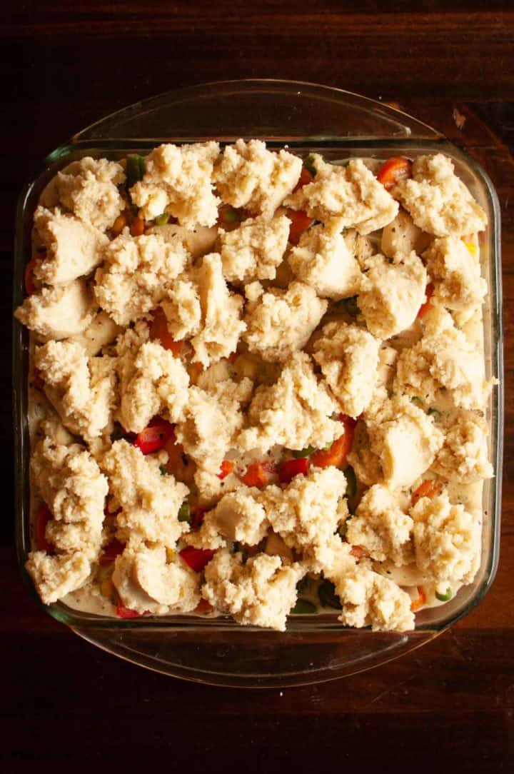 grandmas' chicken and biscuit cobbler with drop biscuit topping ready to go in oven