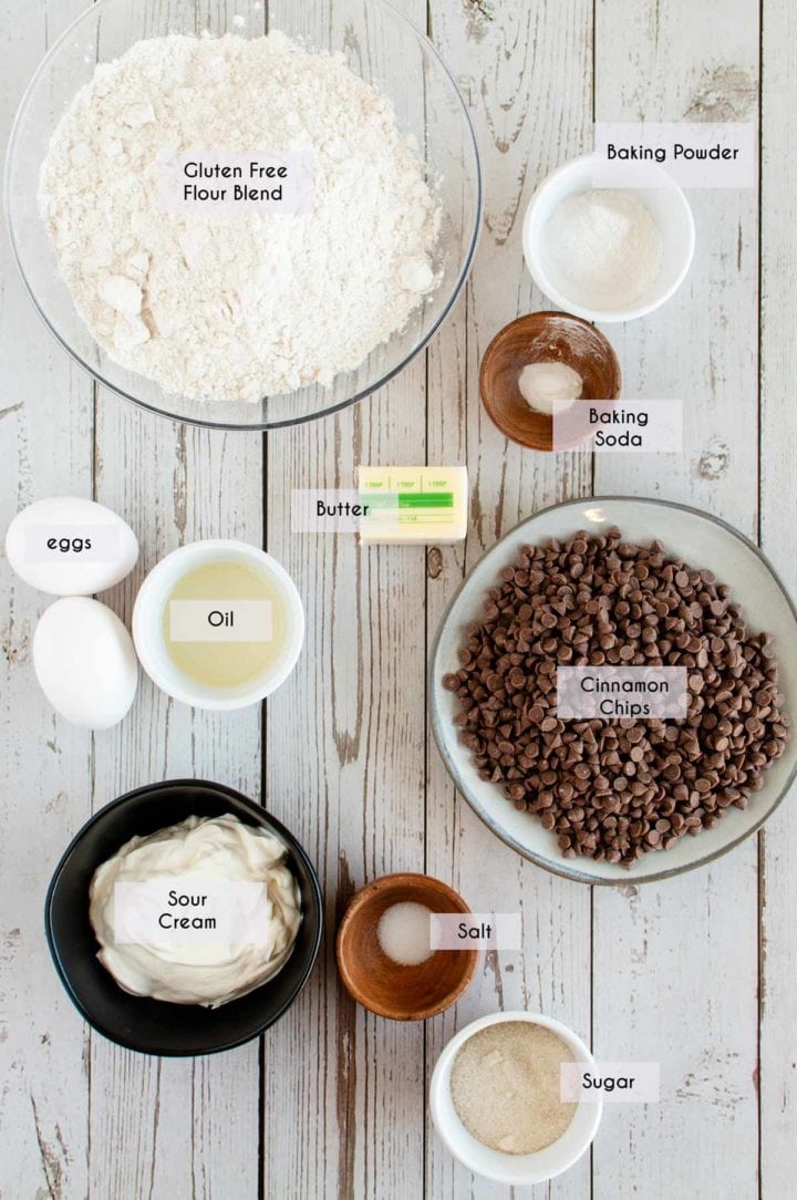 picture of ingredients needed for gluten free cinnamon scones laid out on white wooden surface