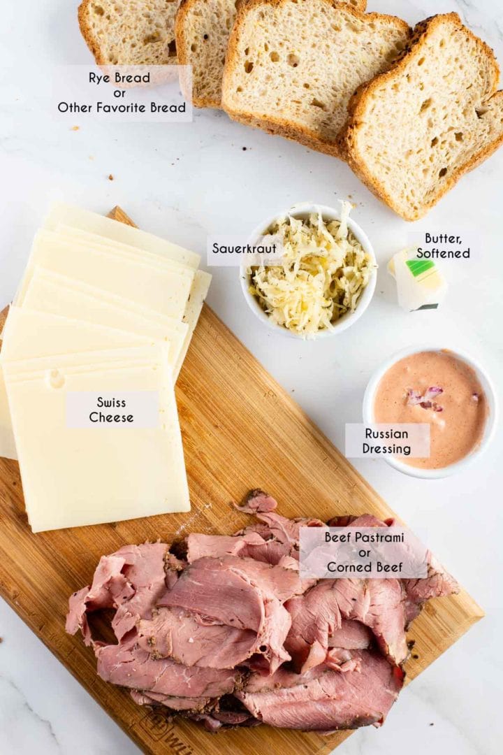 image of ingredients needed for reuben sandwich displayed on marble surface