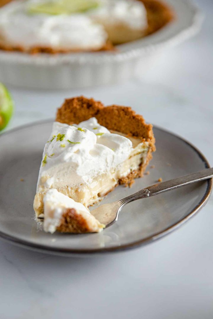 gluten free key lime pie slice with a bit on the fork