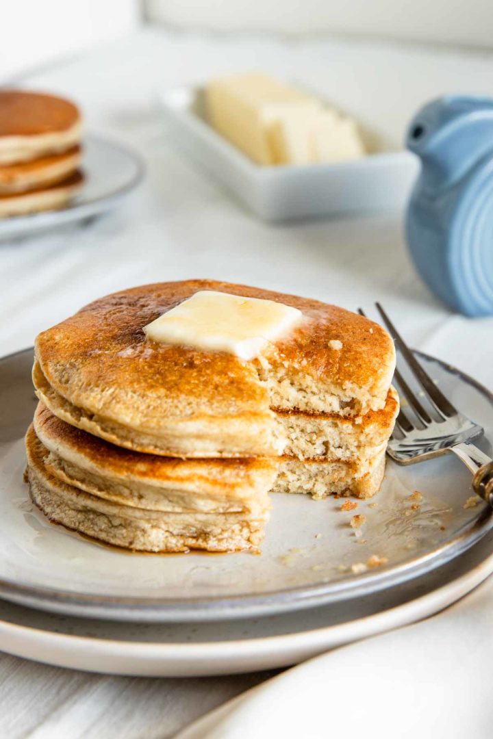 fluffy banana pancakes with a bite taken out of them