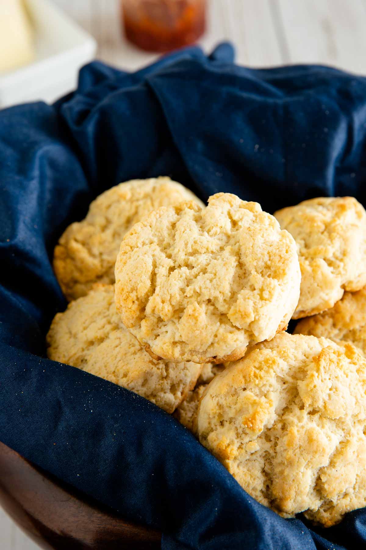 gluten free biscuits displayed in a serving bowl with a blue cloth